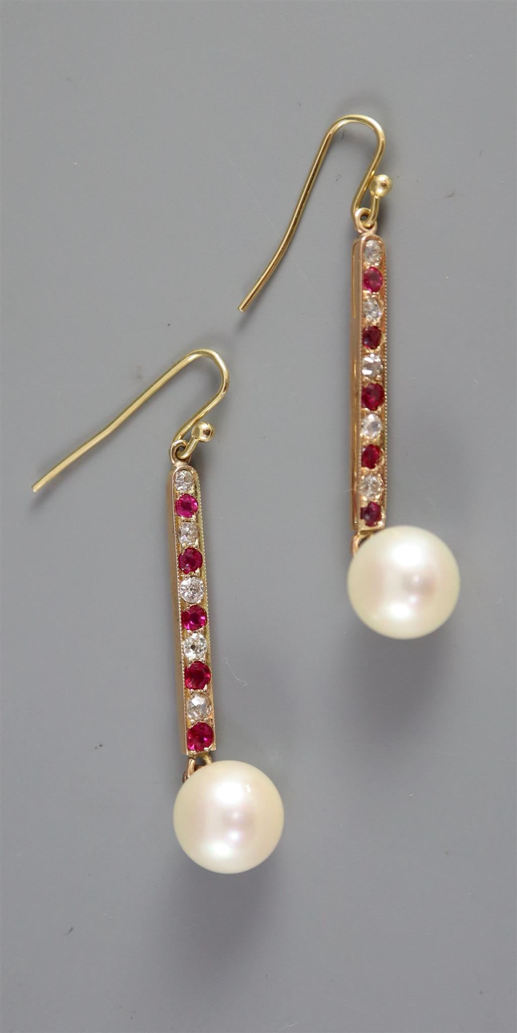 A pair of gold, channel set ruby and diamond drop cultured pearl line earrings,